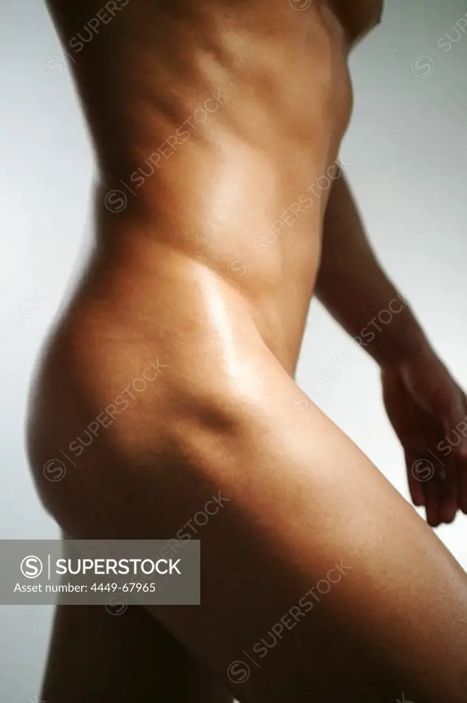 Mid section of a naked young man