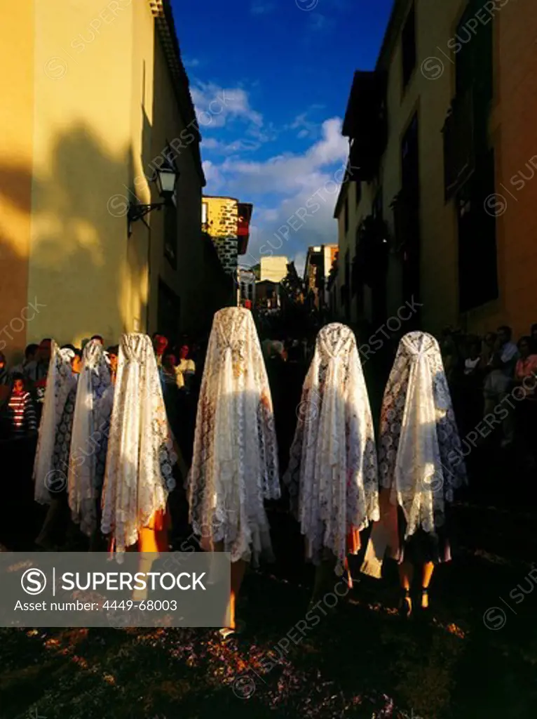 Ladies with mantillas, lace scarfs, traditional headcovering, procession on floral carpets, old town of La Orotava, Tenerife, Canary Islands, Spain