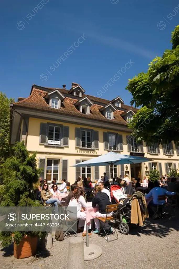 People sitting on terrace of a restaurant, Thun (largest garrison town of Switzerland), Bernese Oberland (highlands), Canton of Bern, Switzerland