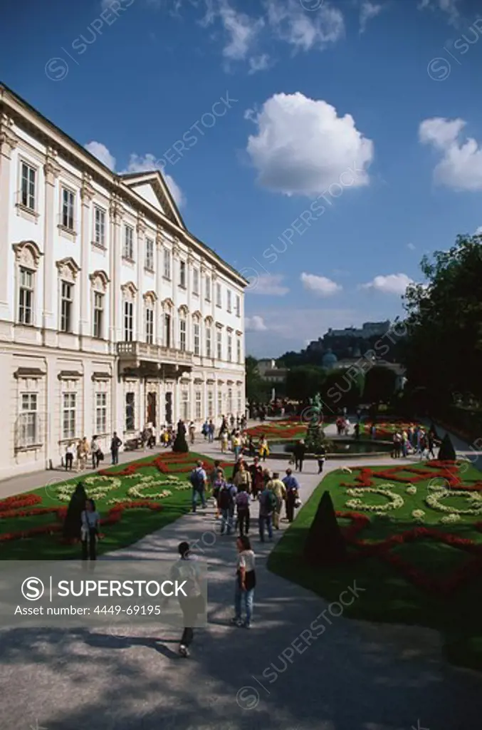Tourists walking through Mirabell garden, Schloss Mirabell, Hohensalzburg Fortress, Salzburg, Austria