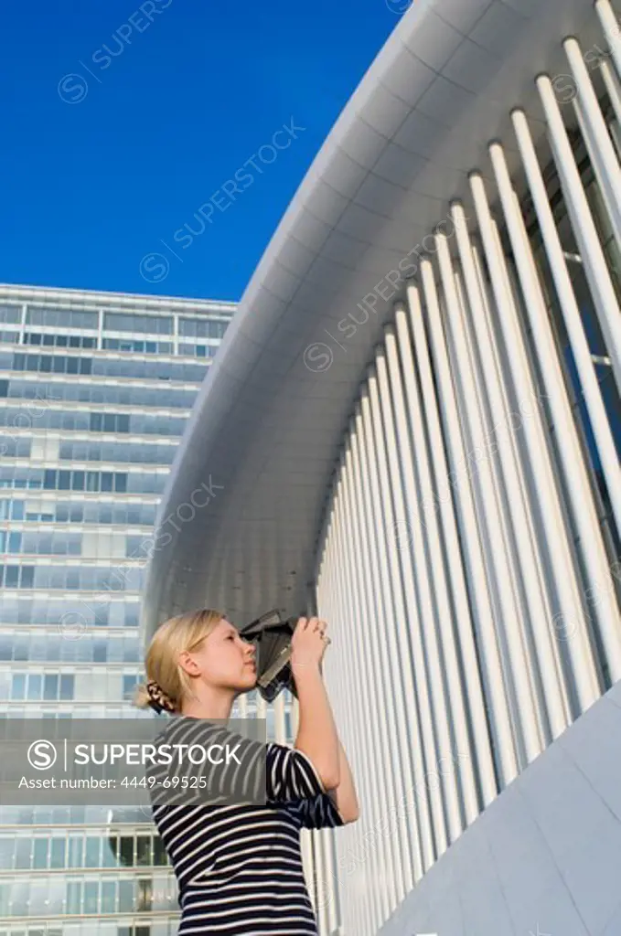 Woman taking picture of building, Luxembourg