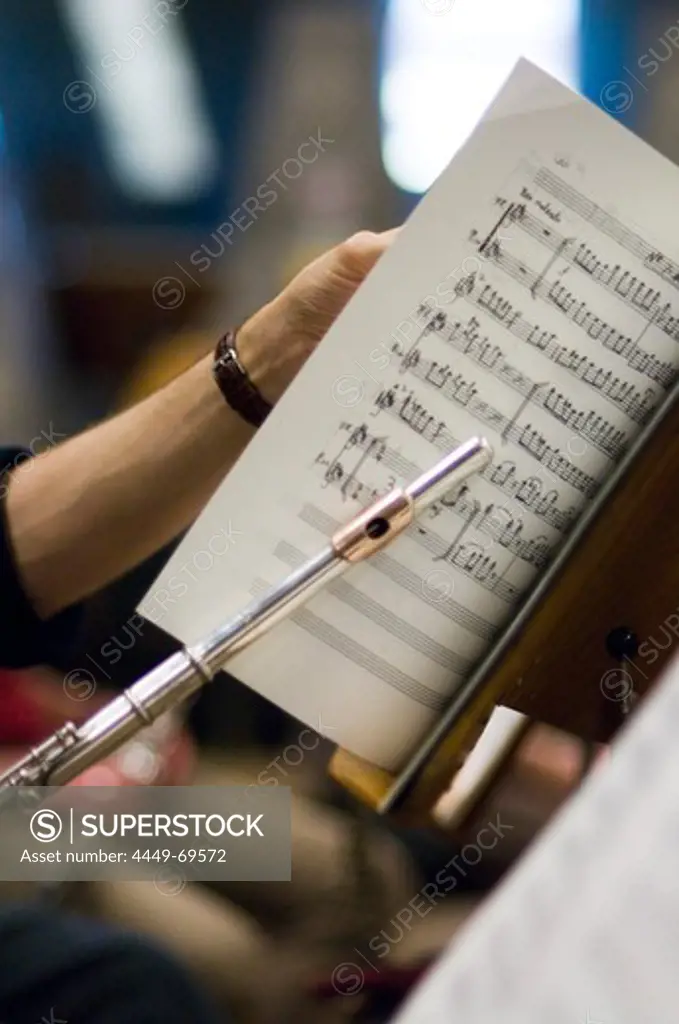 Transverse flute player with music sheet, Munich Symphonic Orchestra, Germany