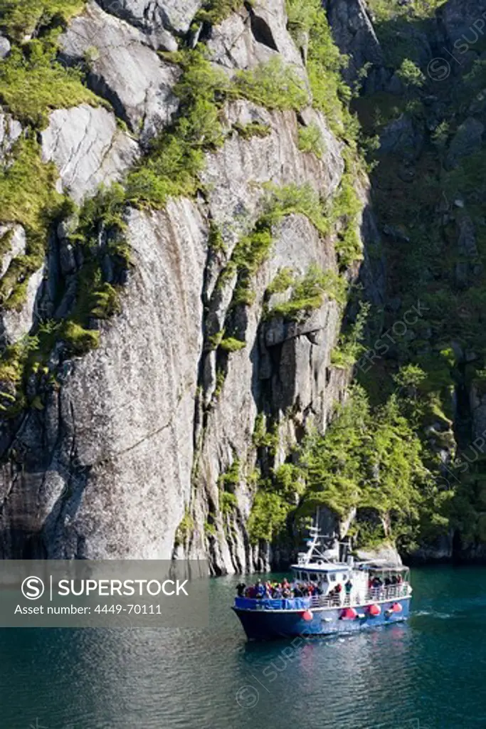 An excursion boat on a Fiord at the Island of Austvagoya, Trollfjord, Lofoten, Norway