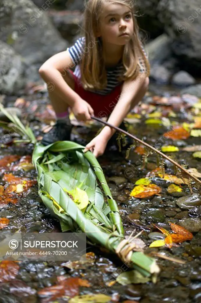 New Years Day: self-made boat (New Zealand flachs) will carry our wishes for the year, cascades, waterfall near Opononi, Northland, North Island, New Zealand