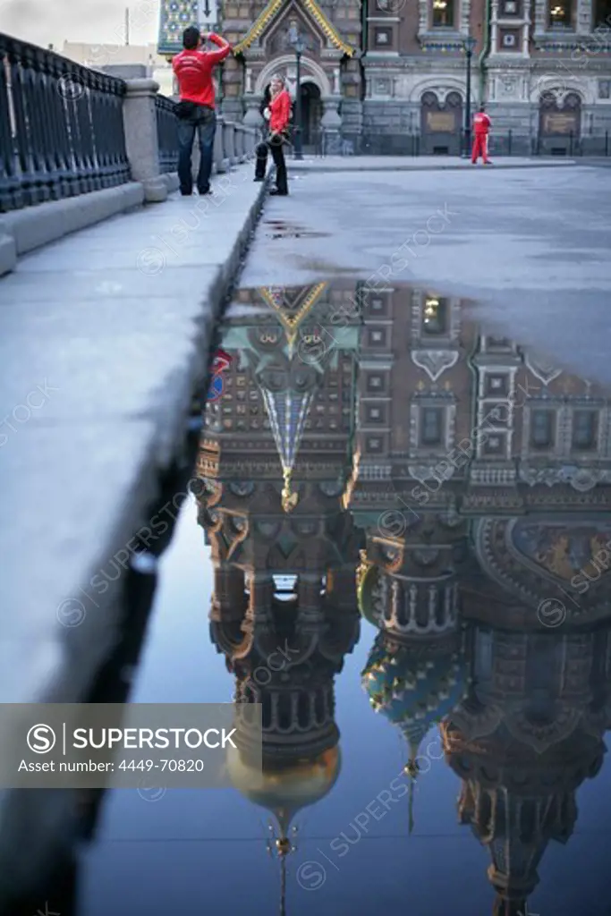 Cathedral of the Resurrection of Christ reflected in a puddle, St. Petersburg, Russia