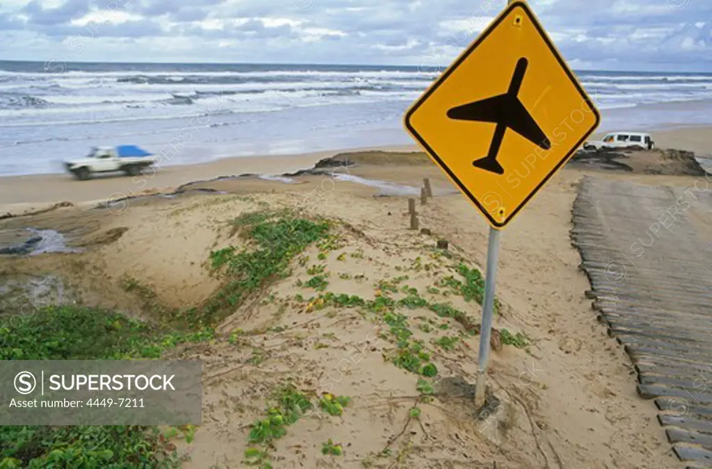 Official sign warning vehicles of aircraft landing on the beach on the east coast of Fraser Island, Fraser Island, Australia