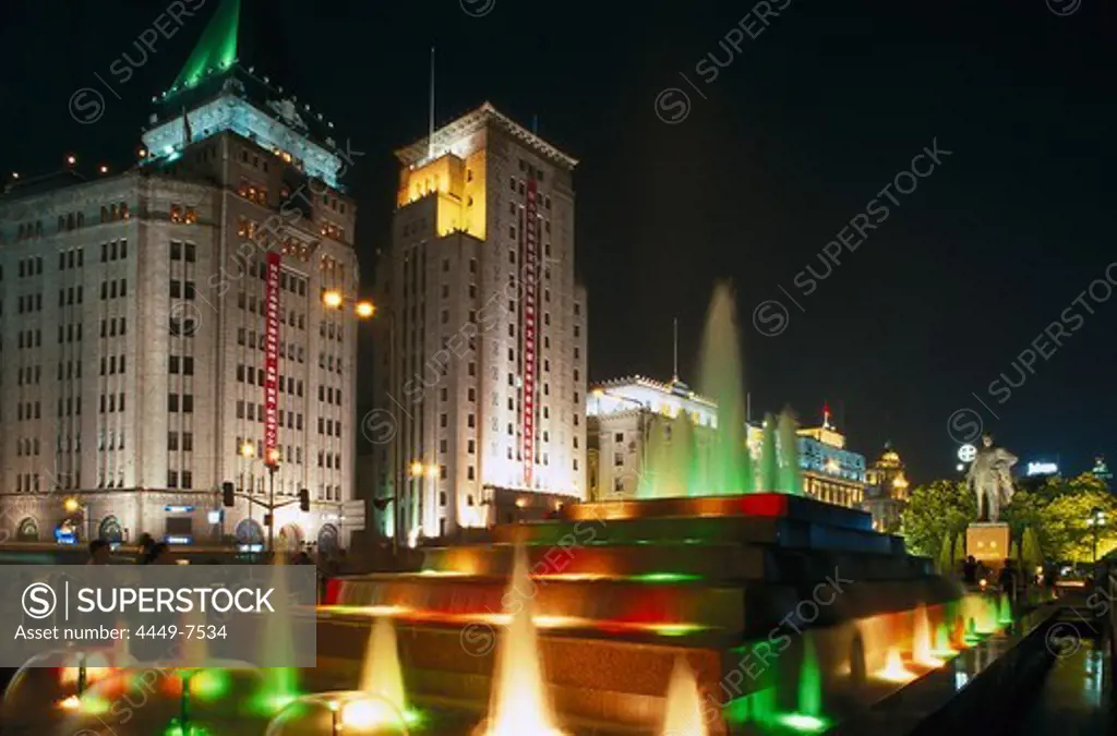 fountain in front of Peace Hotel, the Bund at night, Shanghai, China