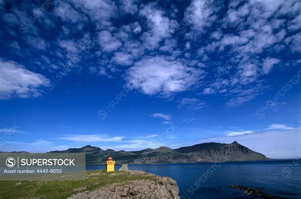 Coastal landscape and bay in the evening light, Faskrudsfjoerdur, Iceland