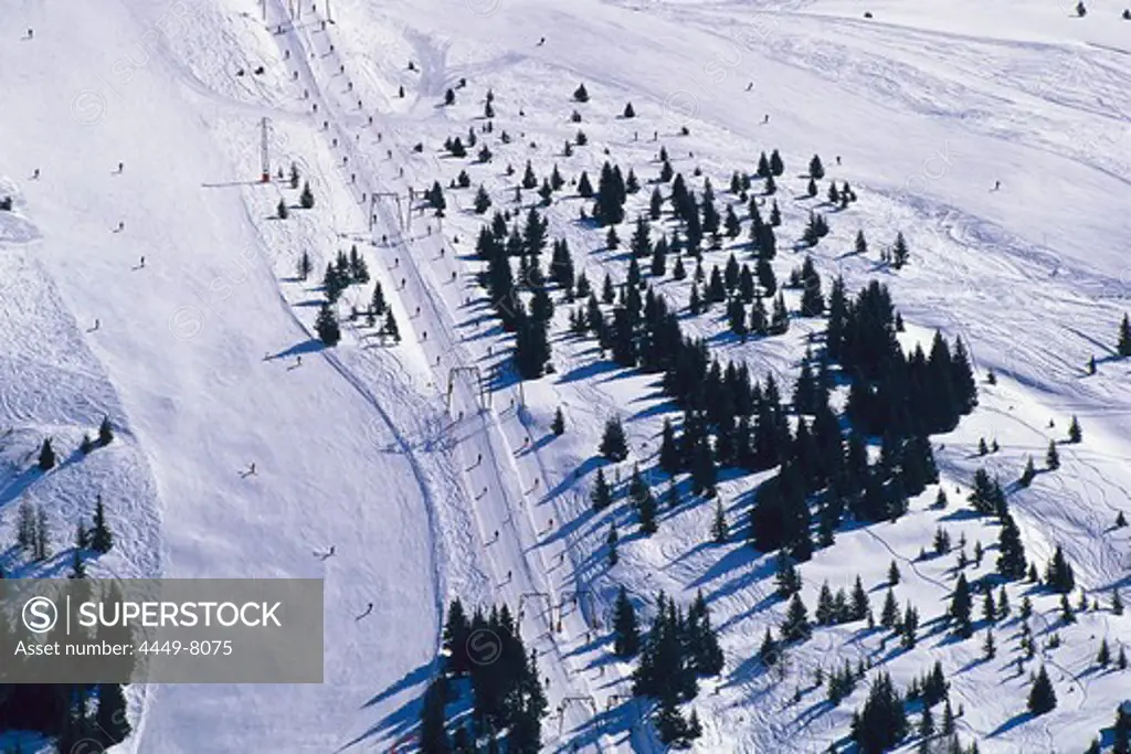 People skiing on a ski slope, Sella Ronda, Dolomites, Italy