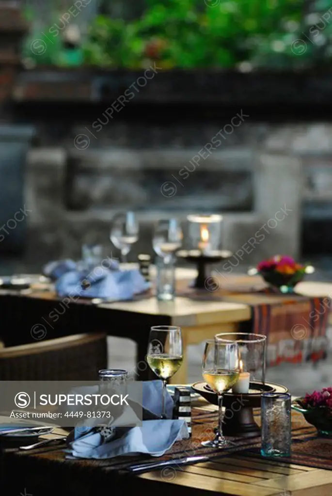 Tables are laid in a restaurant in the evening, Matahari Beach Resort & Spa, Pemuteran, North-west Bali, Indonesien, Asia