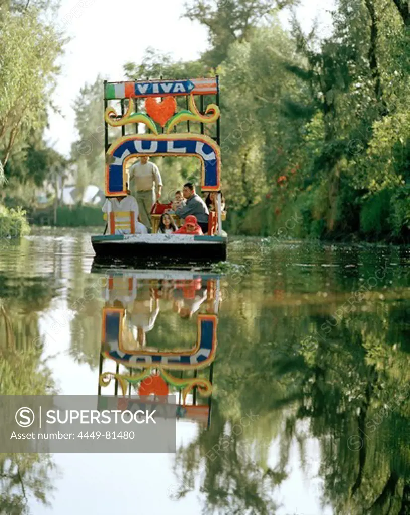People on an excursion boat between swimming islands, Canales Embarcadero, Xochimilco, Mexico, America