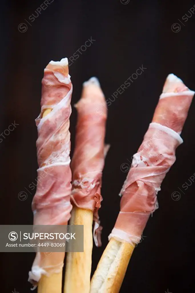 Famous ham from San Daniele, served wrapped around bread sticks, Friuli-Venezia Giulia, Italy