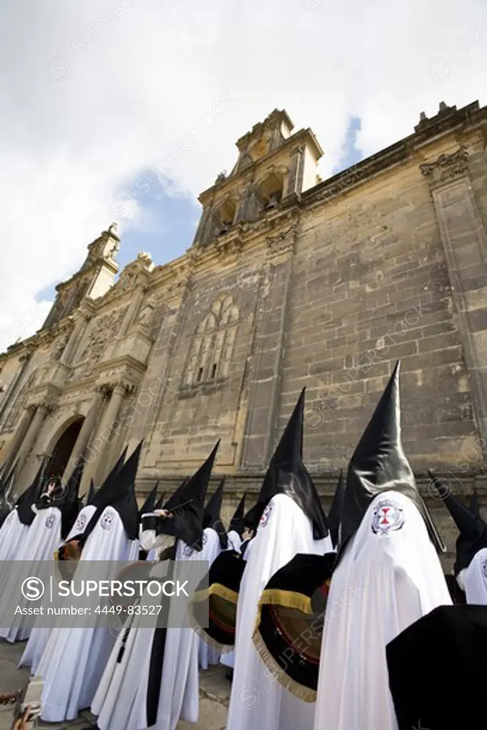 Semana Santa, holy week in Ubeda with the church Santa Maria de los Reales Alcázares in the background, Province Jaen, Andalucia, Spain