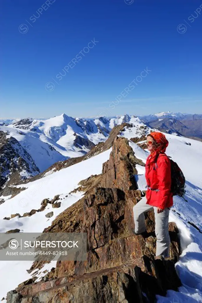 Woman enjoying view from Monte Vioz, Ortler range, Trentino-Alto Adige/South Tyrol, Italy