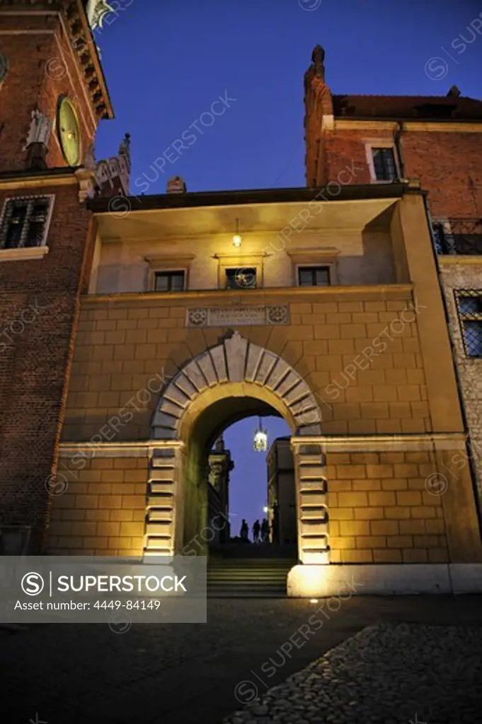 Illuminated gate to Wawel cathedral, Krakow, Poland, Europe