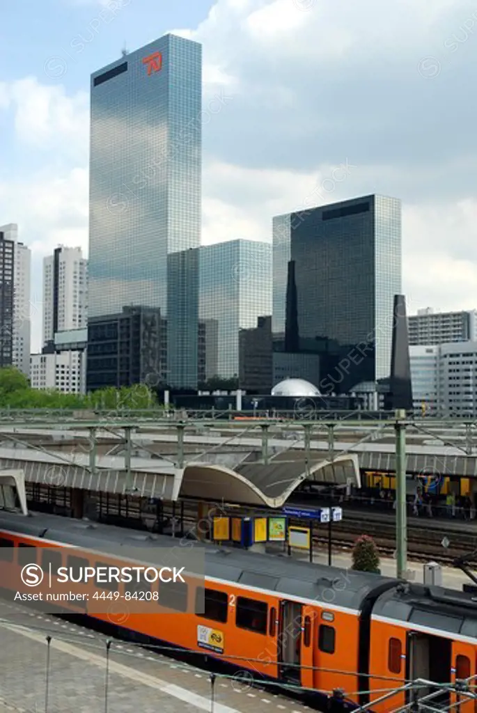 Train at the main railway station, Centraal Station, in the back the Delftse Poort office building at the Weena, Rotterdam, Zuid-Holland, South-Holland, Nederland, the Netherlands, Europe