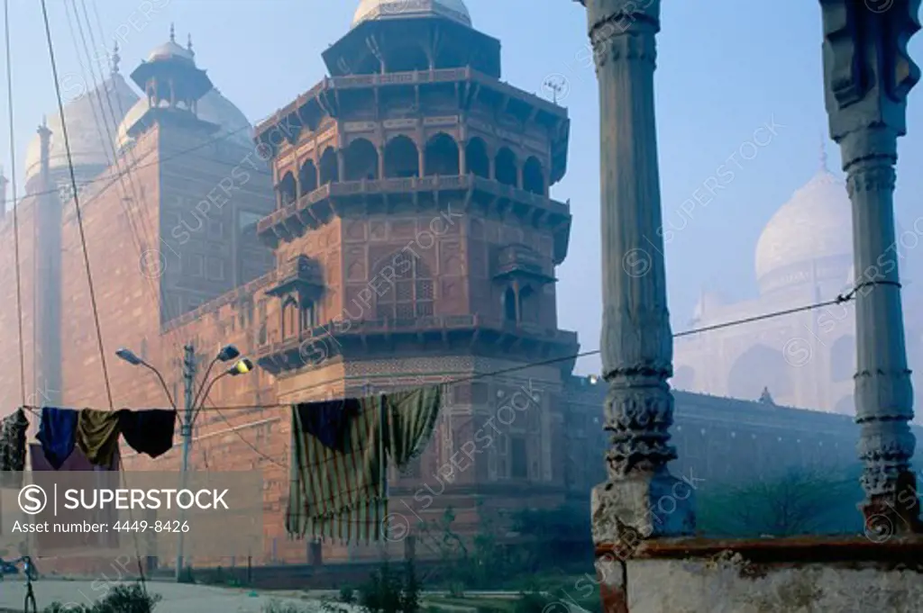 Clothesline with washing in front of Taj Mahal in the morning haze, Agra, Uttar Pradesh, India