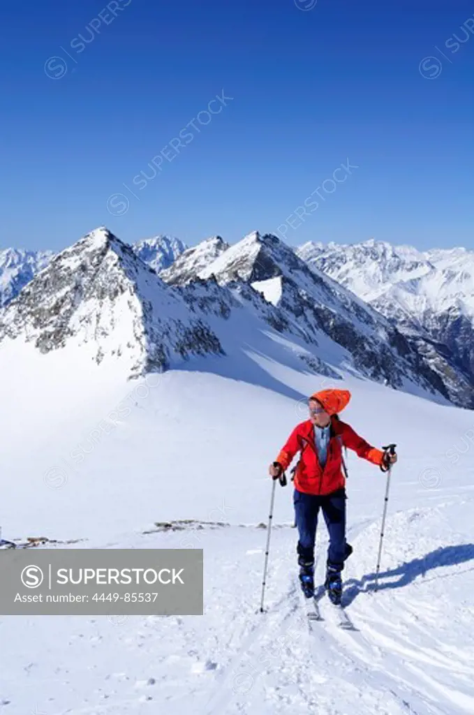 Female backcountry skier ascending to hut Zittelhaus, Hoher Sonnblick, Rauris valley, Goldberg mountain range, Hohe Tauern, Salzburg, Austria