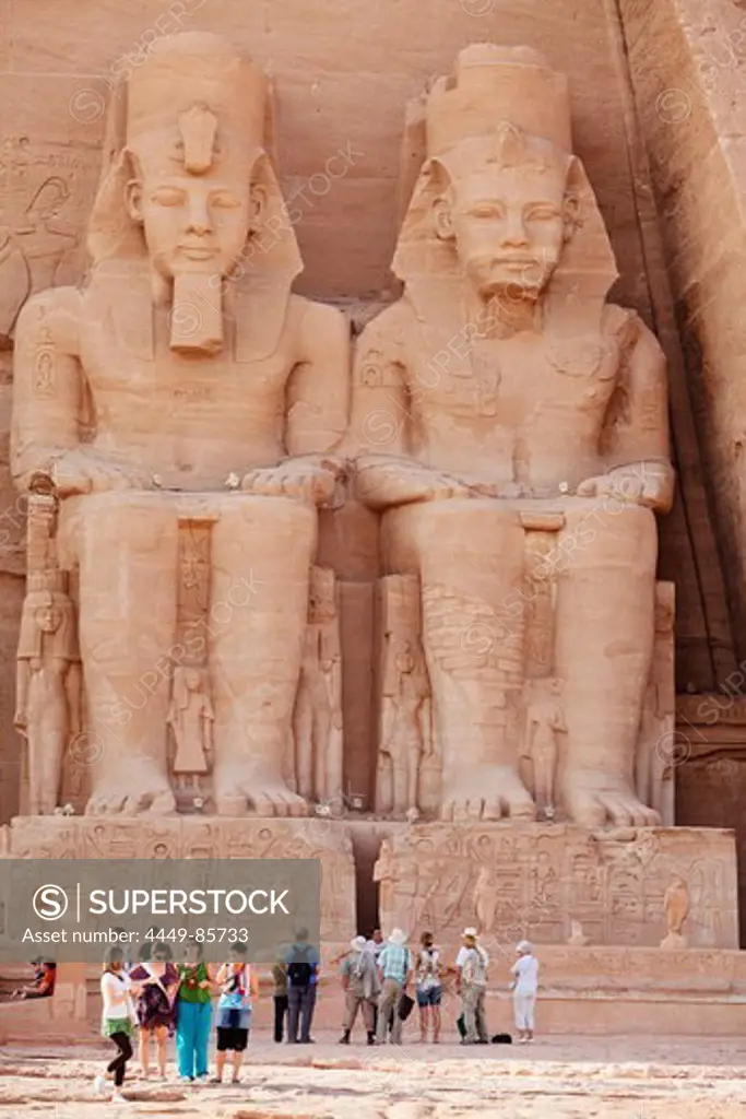 Tourists in front of the giant statues at the Temple of Rameses II., Abu Simbel, Egypt, Africa
