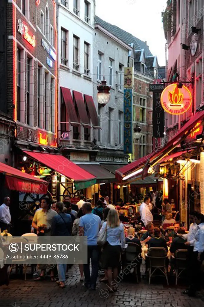 Pubs, bistros and restaurants in the Rue des Bouchers in the evening, Brussels, Belgium, Europe