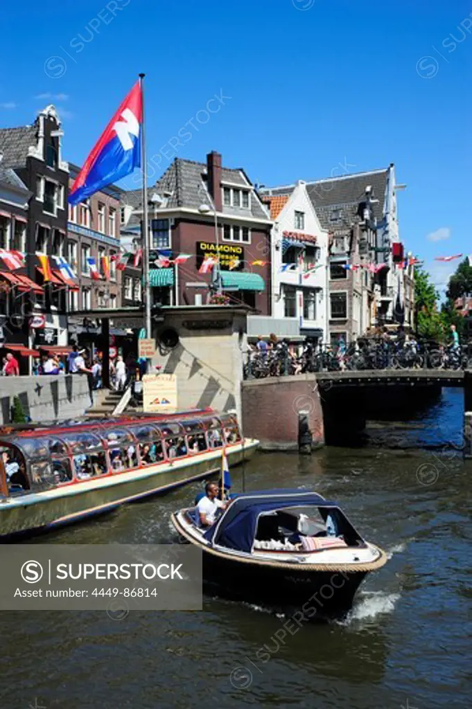 Boat on the Oude Turfmarkt canal, Amsterdam, the Netherlands, Europe