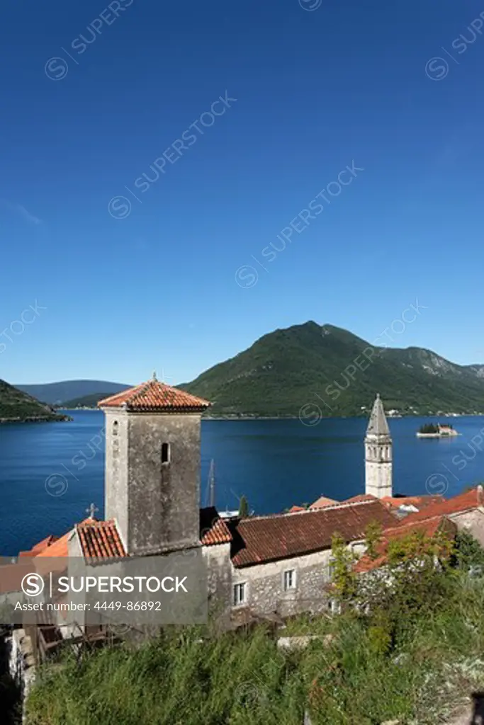 View of Sveti Nikola church with bell tower, in the background Gospa od Skrpjela island, Perast, Bay of Kotor, Montenegro, Europe