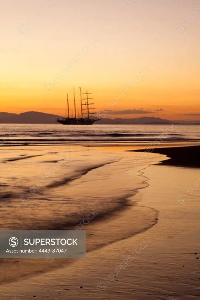 Beach and sailing cruiseship Star Flyer (Star Clippers Cruises) at sunset, Puerto Caldera, Puntarenas, Costa Rica, Central America, America