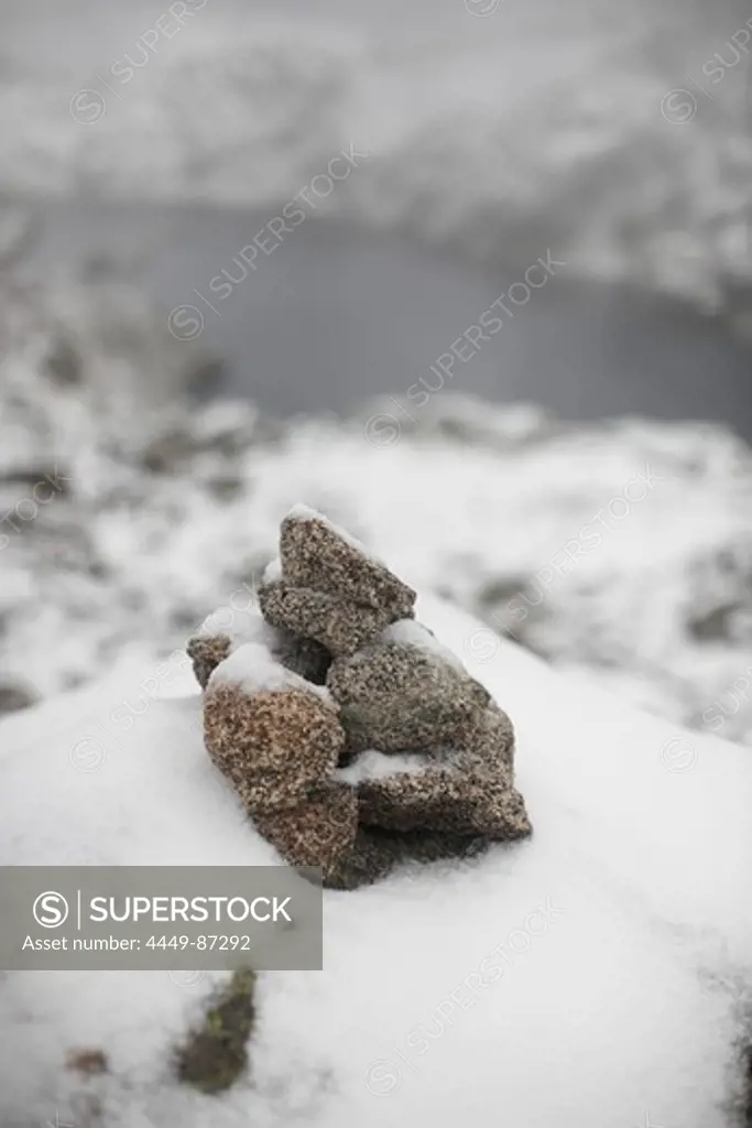 Snow-covered cairn, Collado de Saburo, Carros de Foc, Aiguestortes i Estany de Sant Maurici National Park, Catalonia, Spain
