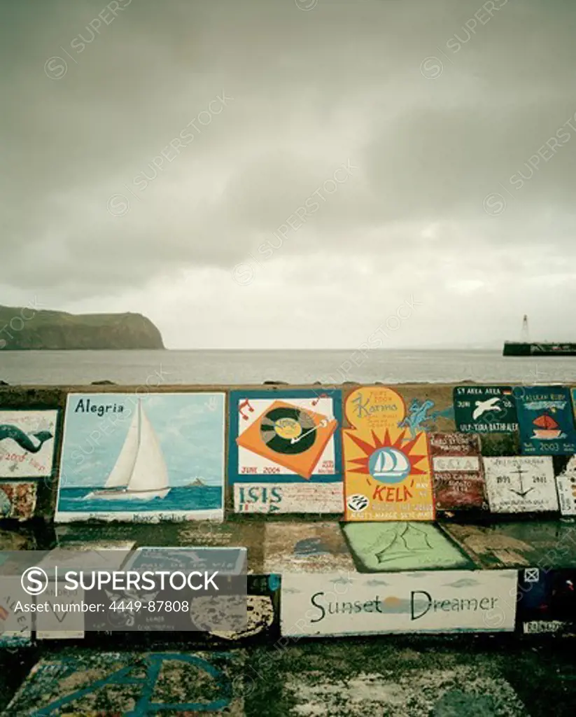Paintings sailors do before they cross the atlantic, on the mole, marina in Horta, Faial island, Azores, Portugal
