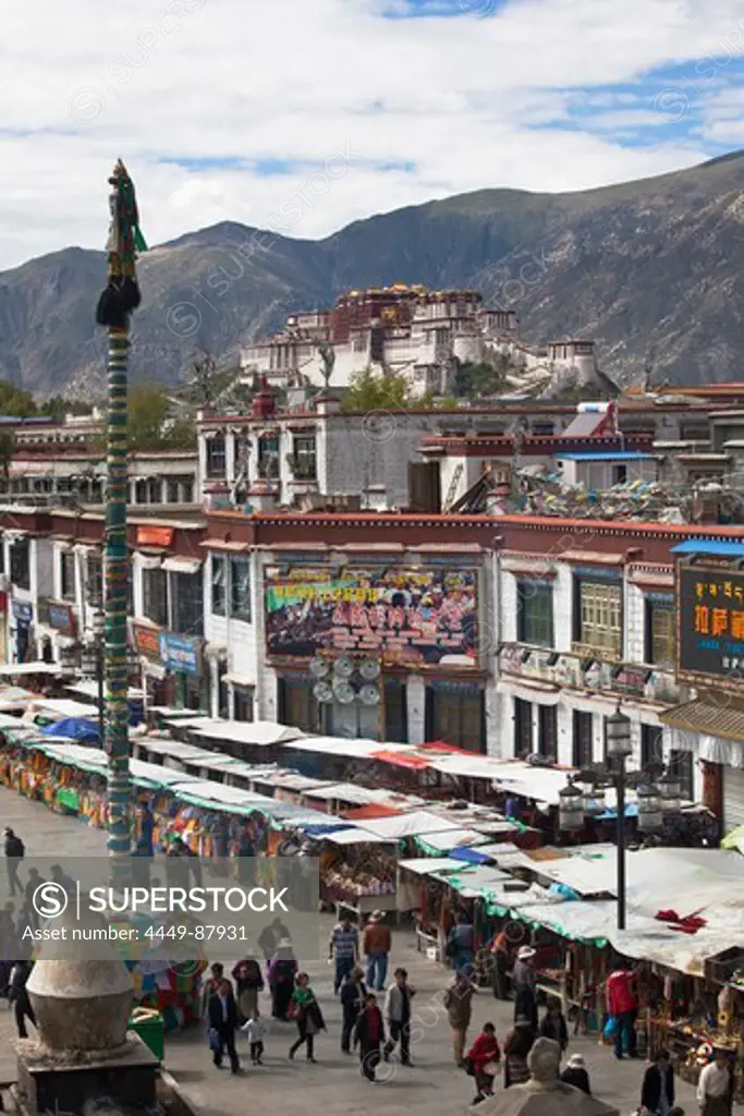 Barkhor Square in the old part of Lhasa with Potala Palace in th, Transhimalaya mountains, Tibet Autonomous Region, People's Republic of China