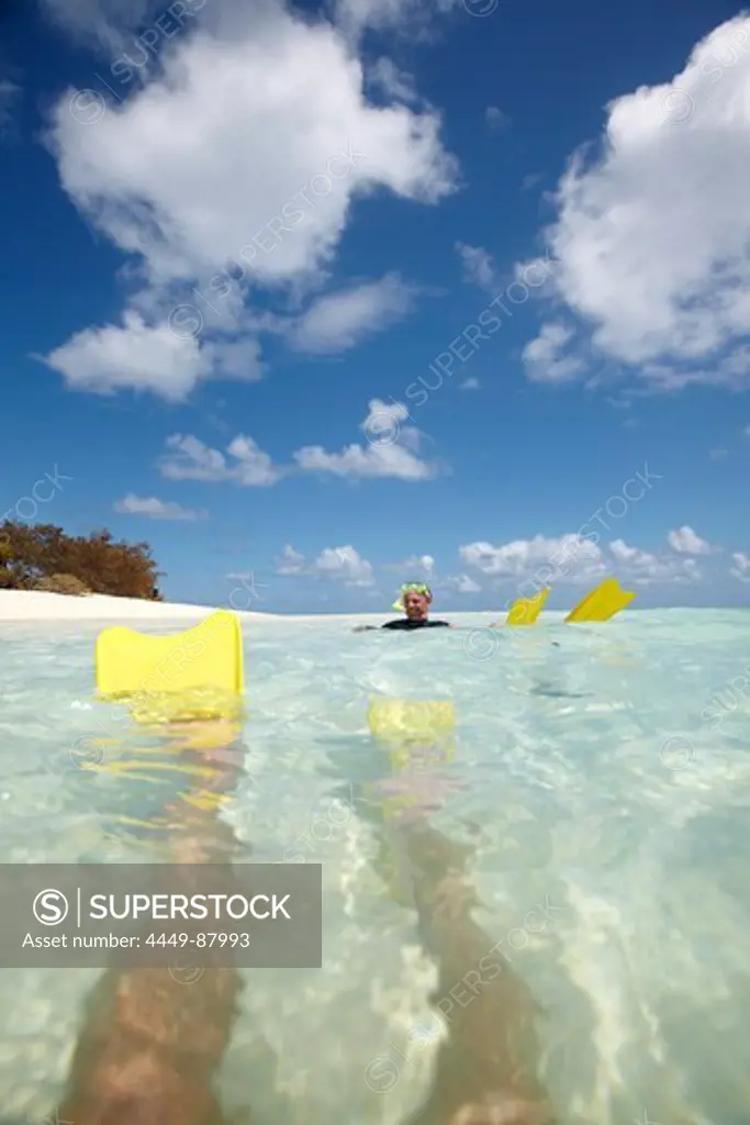 Snorkeler with fins near Heron Island, eastern part is part of the Capricornia Cays National Park, Great Barrier Reef Marine Park, UNESCO World Heritage Site, Queensland, Australia
