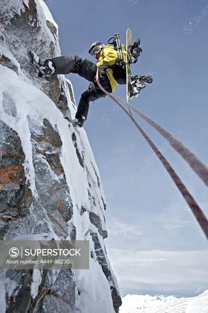 Snowboarder rappeling, Chandolin, Anniviers, Valais, Switzerland
