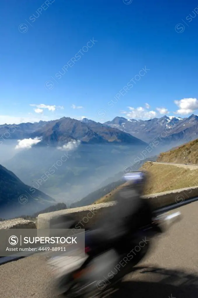 Motorcyclist at Jaufenpass in front of mountain panorama, Passeier valley, Alto Adige, South Tyrol, Italy, Europe