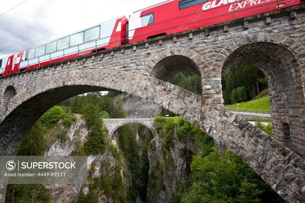 Train, Glacier Express, crossing the Solis Bridge over Schyn gorge, Graubuenden, Switzerland