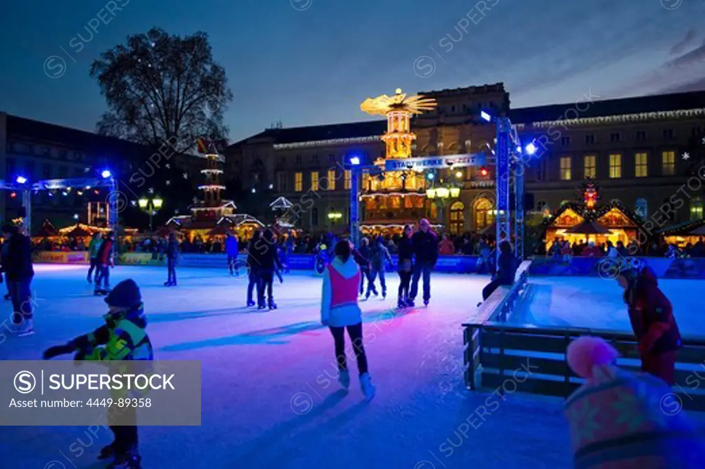 People ice skating at the Christmas market, Karlsruhe, Baden-Wuerttemberg, Germany