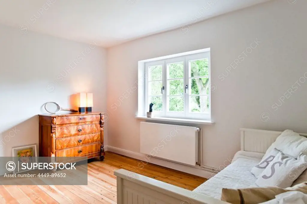 Bedroom with Bed and chest of drawers, House furnished in country style, Hamburg, Germany