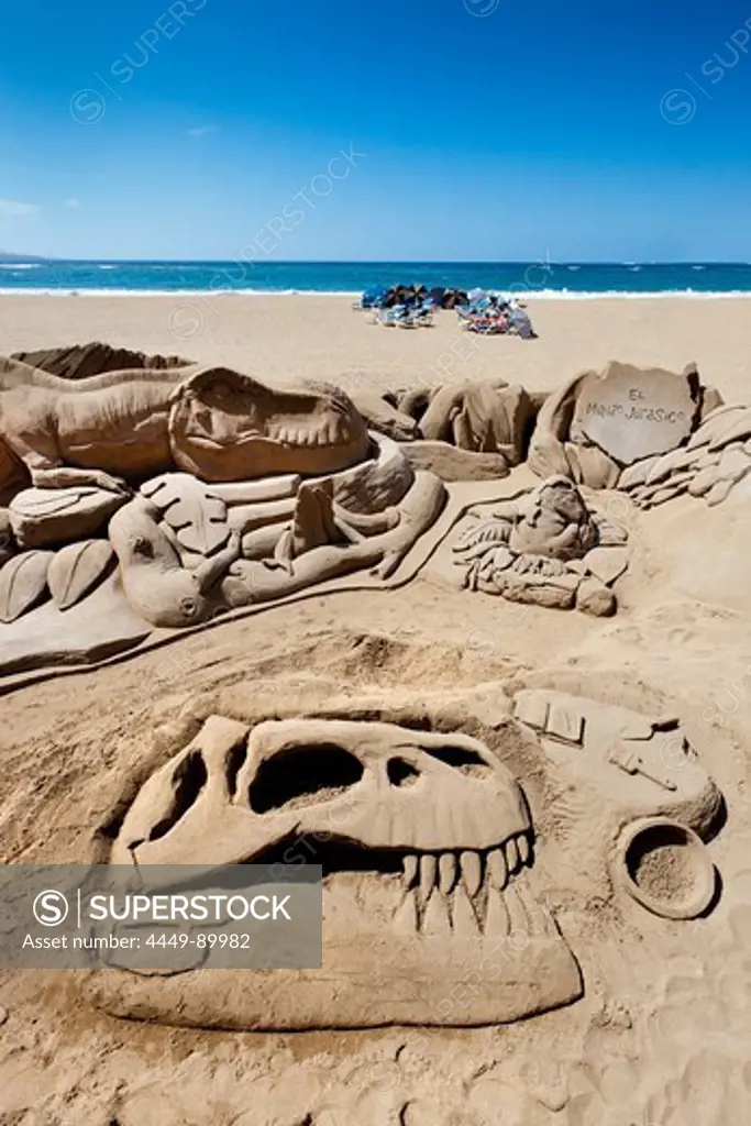 Dinosaur sand sculpture in the sunlight, Playa de Las Canteras, Las Palmas, Gran Canaria, Canary Islands, Spain, Europe