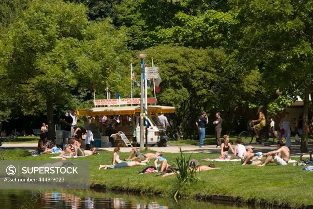 People, Meadow, Icecream, Vondelpark, People relaxing on meadow in Vondelpark, Ice Cream Van in background, Amsterdam, Holland, Netherlands