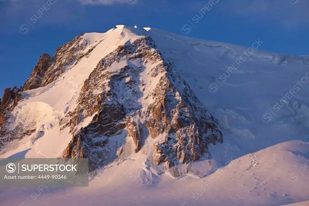 Ski tracks and rock climbers below Mont Blanc du Tacul, Chamonix, Mont-Blanc, France