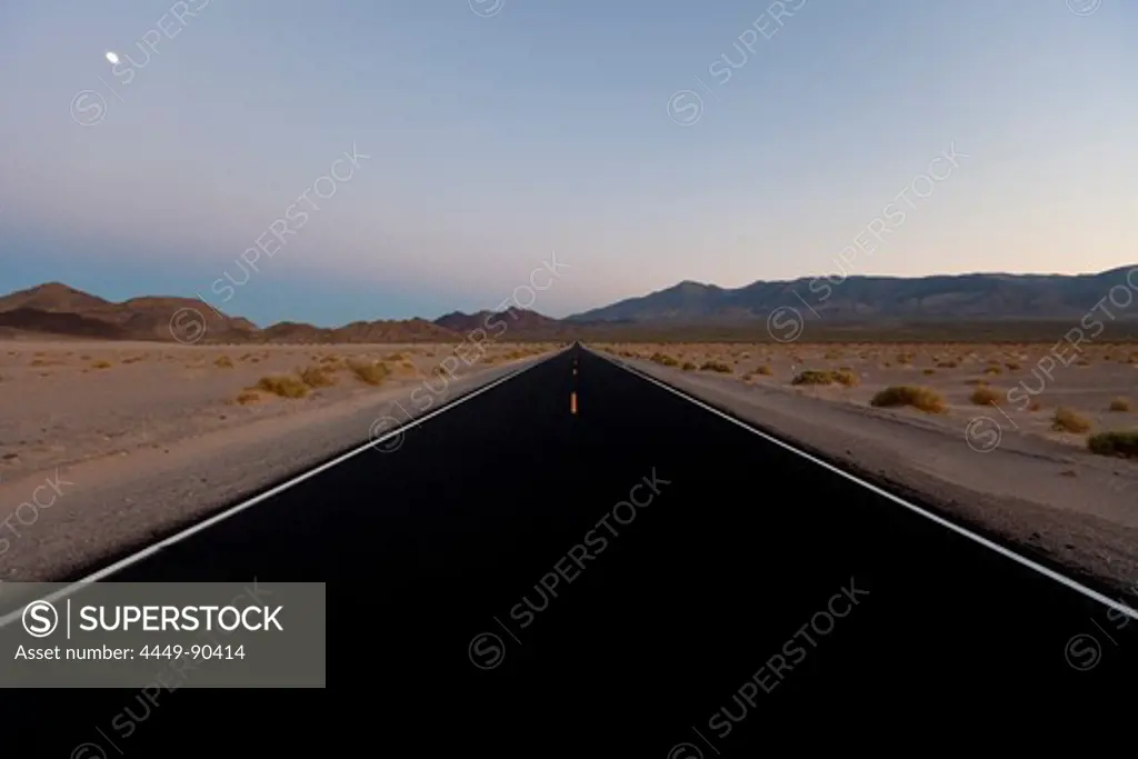Moon above Death Valley Road and desert mountains, San Bernardino, California, USA, America