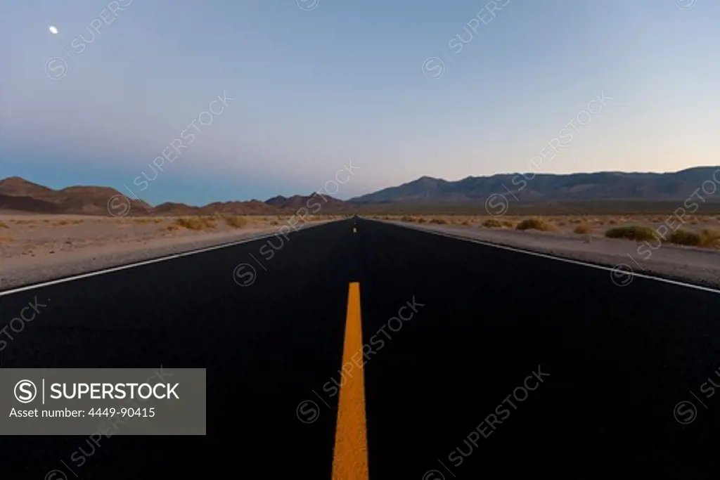 Moon above Death Valley Road and desert mountains, San Bernardino, California, USA, America