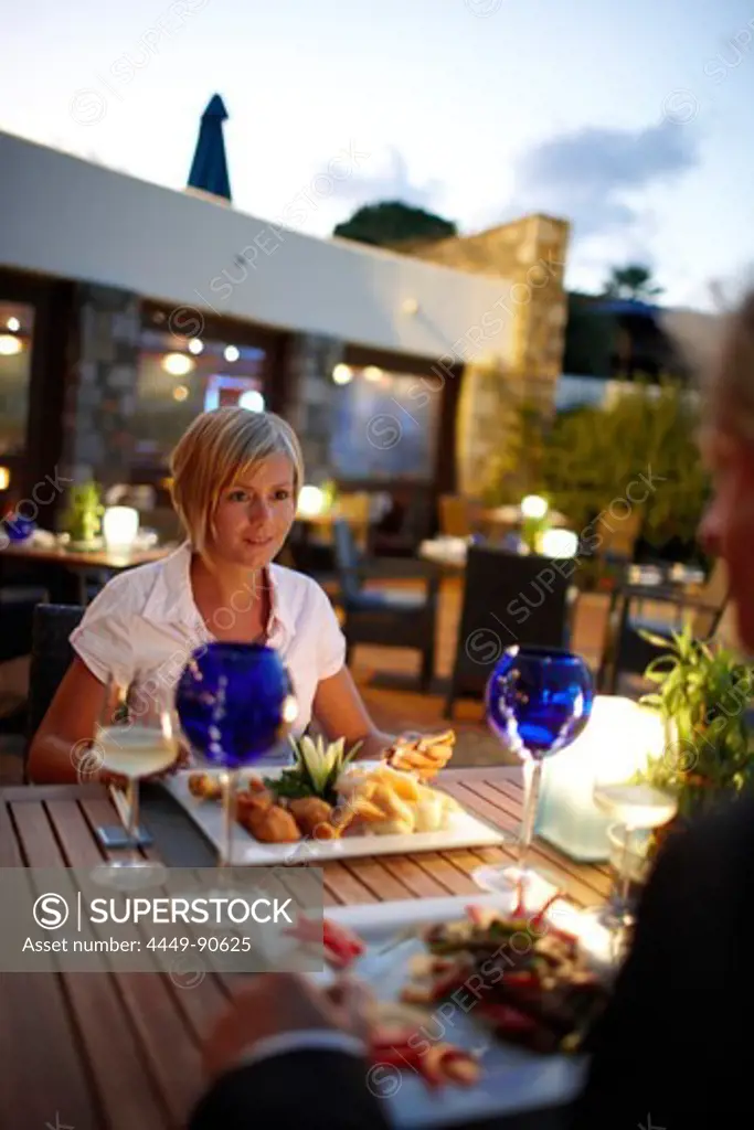 Couple having dinner at restaurant Ariadne, Elounda Beach Resort, Elounda, Crete, Greece