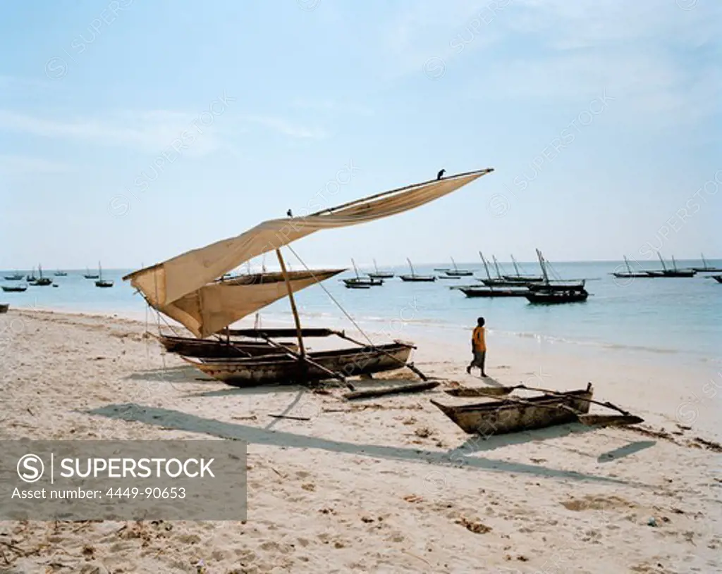 Traditional fishing canoe's laying on the beach of Nungwi, northern Zanzibar, Tanzania, East Africa