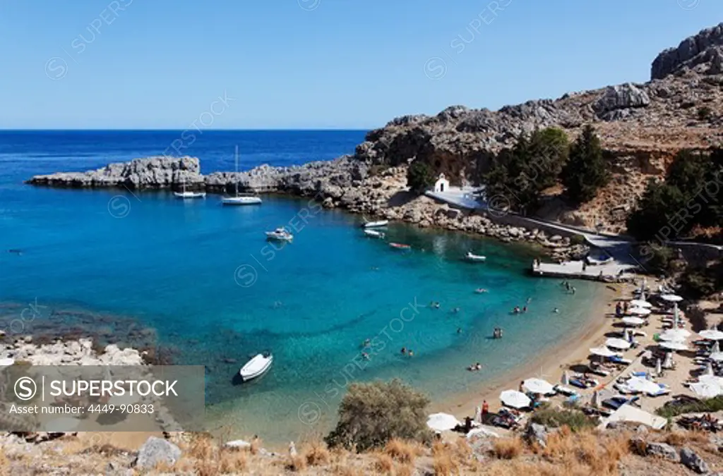 People on the beach at Agios Pavlos Bay, Lindos, Rhodes, Dodecanese Islands, Greece, Europe