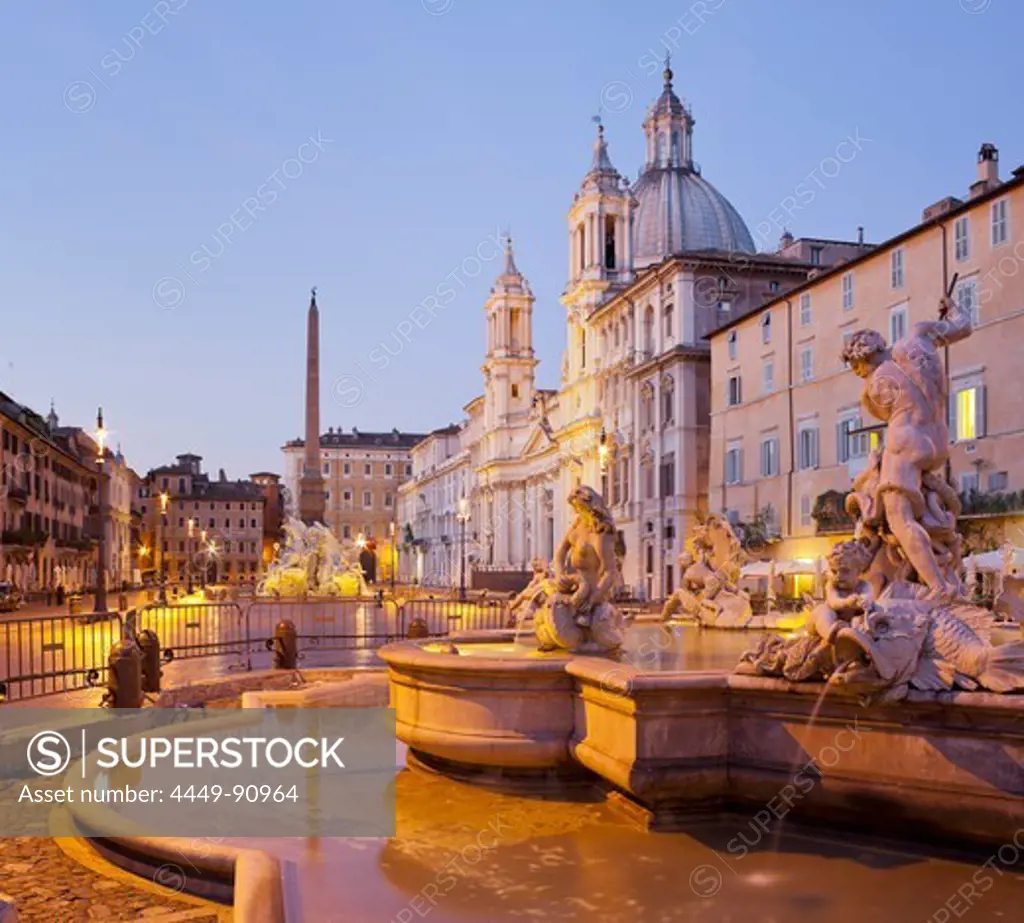 Fountain of the Four Rivers, Fontana dei Quattro Fiumi and church, Sant'Agnese in Agone in the evening light, Piazza Navona, Rome, Lazio, Italy