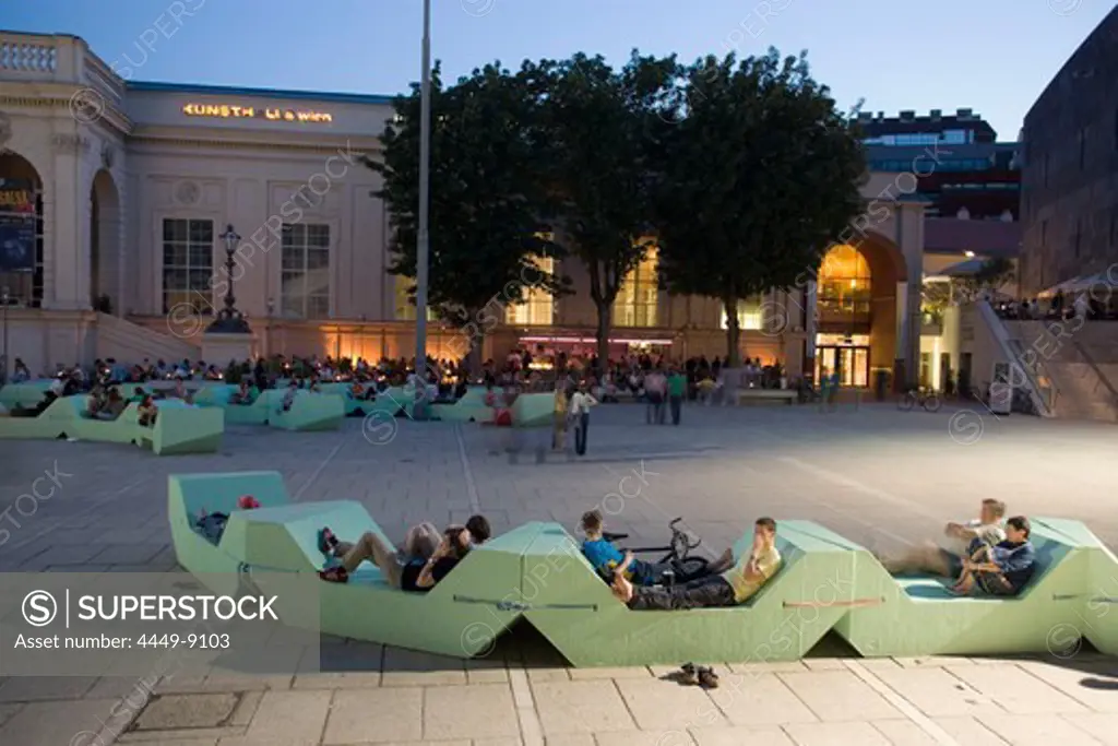People sitting in a bar in front of Kunsthalle Wien at MuseumsQuartier in the evening, Vienna, Austria