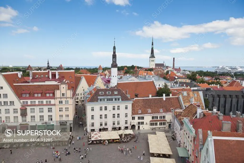 View of the town hall square, Raekoja Plats in Tallinn, with the towers of the Holy Spirit church and Saint Olav's church in the background, Tallinn, Estonia