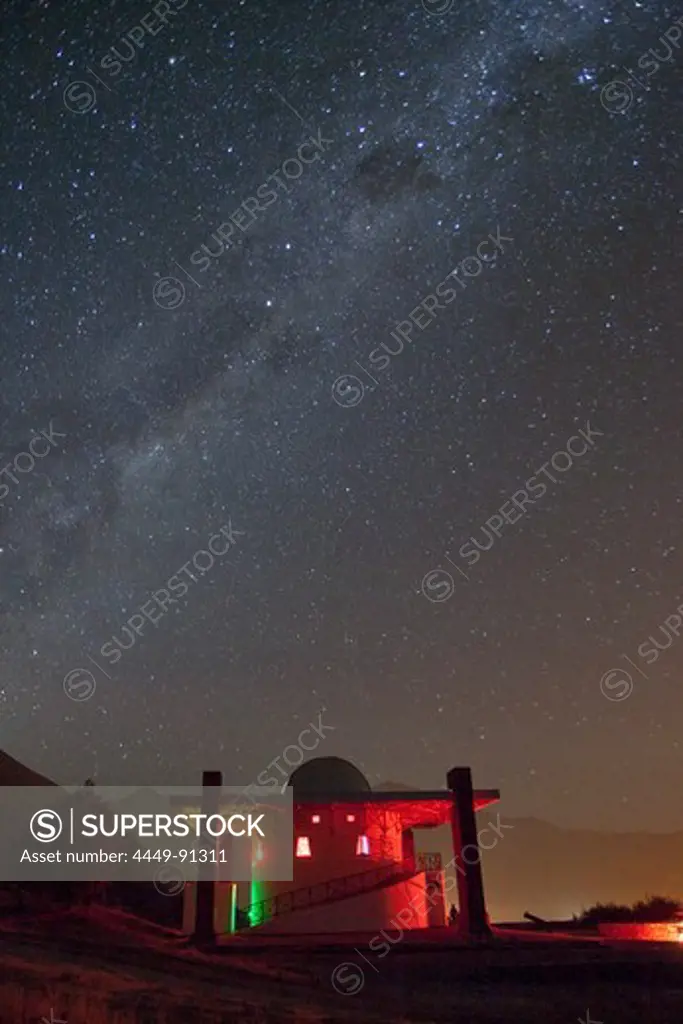 Shooting star streaks through Milky Way in clear night sky above Mamalluca Observatory, near Coquimbo, Coquimbo, Chile, South America