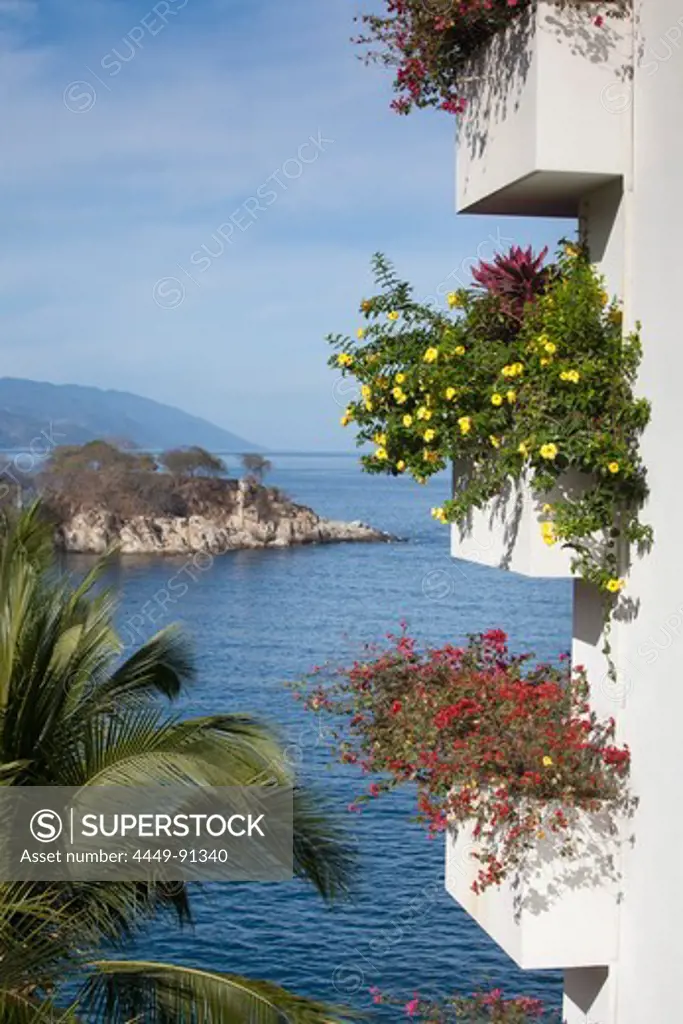 Tropoical flowers on balconies of high-rise building at Mismaloya, near Puerto Vallarta, Jalisco, Mexico, Central America