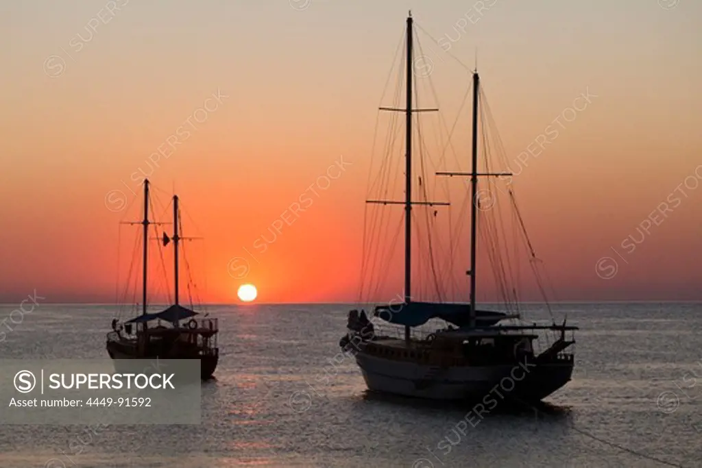 Sailing boats at sunrise at sea, Cirali, Mediterranean Sea, Lykia, Turkey